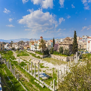 Ancient Agora Of Athens in Greece - a public space in ancient Athens that served as the center of political, commercial, and social activity, featuring ruins of historic buildings such as the Temple of Hephaestus and the Stoa of Attalos.