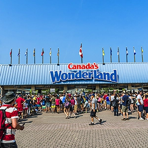 Excited visitors enjoying thrilling attractions and rollercoasters at Canada