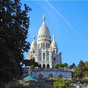 Spectacular view of the white-domed Basilica of the Sacre Coeur on Montmartre hill