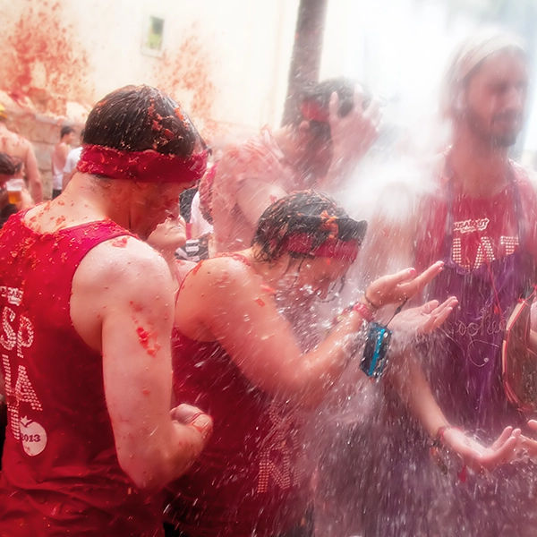 Participants enjoying the Tomatina Festival, a lively tomato fight in Buñol, Spain