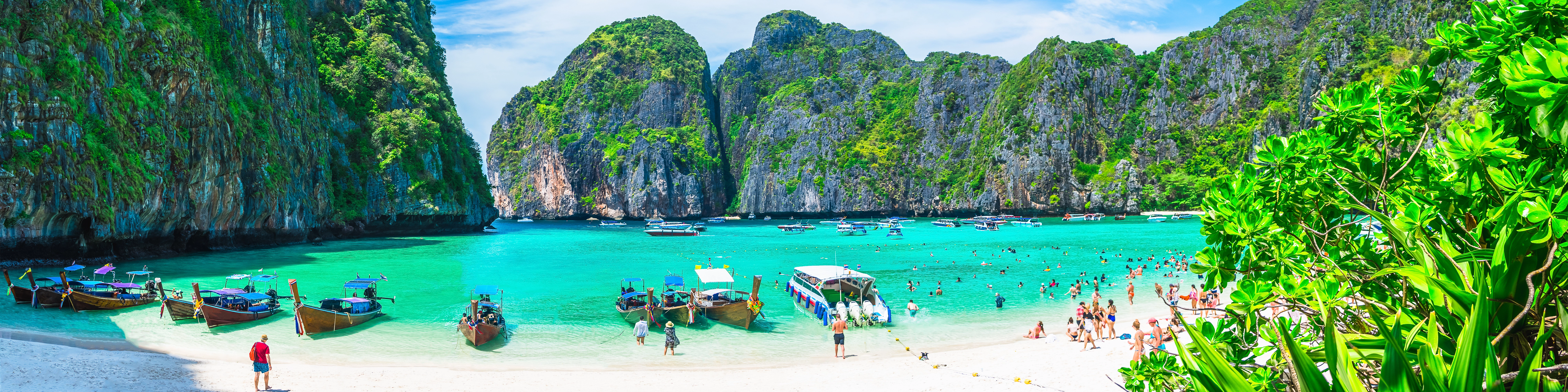 Panoramic view of pristine beaches in Asia with crystal clear waters and lush palm trees