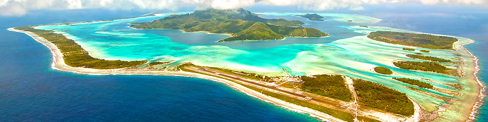 Tropical paradise in Bora Bora with crystal-clear turquoise waters, overwater bungalows, and lush green palm trees