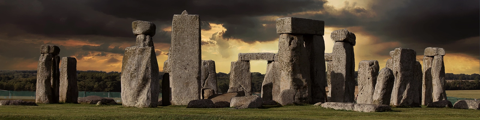 View of Stonehenge with dramatic skies in the background.