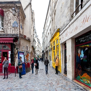 A picturesque view of the historic Le Marais district, with its charming narrow streets, trendy shops, and beautiful architecture in Paris, France.