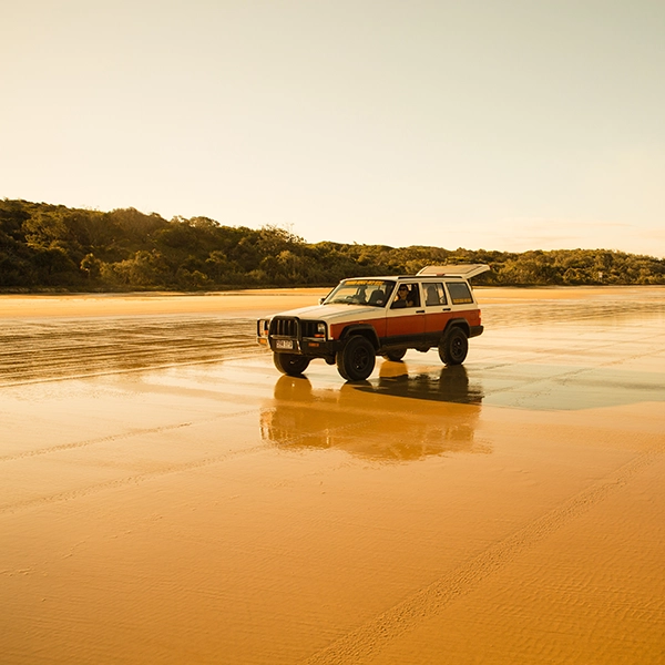 Aerial view of the stunning sandy beaches and lush greenery on Fraser Island, Australia