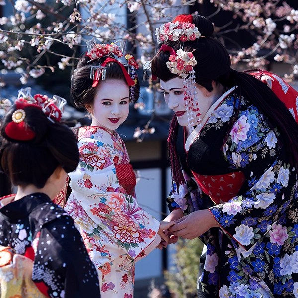 Kimono Fashion Parade - a group of people dressed in traditional Japanese kimonos, showcasing a beautiful array of colors and patterns.